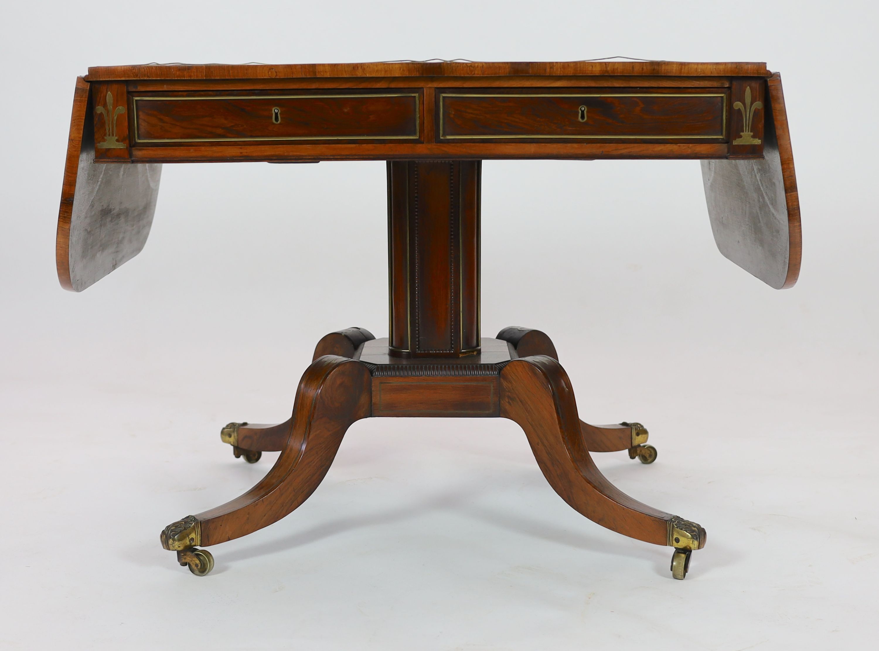 A Regency brass inset rosewood sofa table W. 94cm. D. 70cm. H. 72cm.